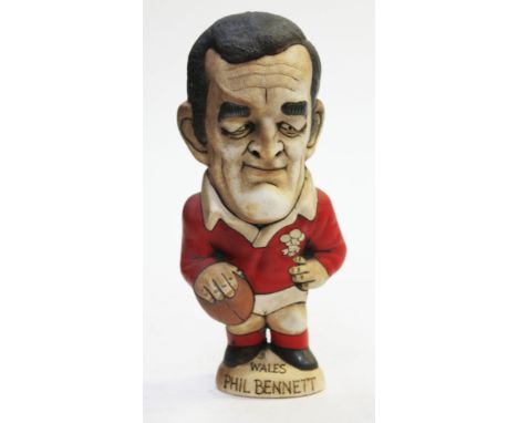 A Groggs ceramic figure of Phil Bennet, height 23cm. Condition - good, general wear.