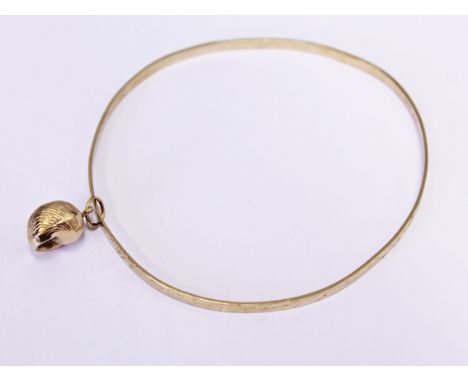 A 9ct gold bangle and charm, wt. 5.4g.