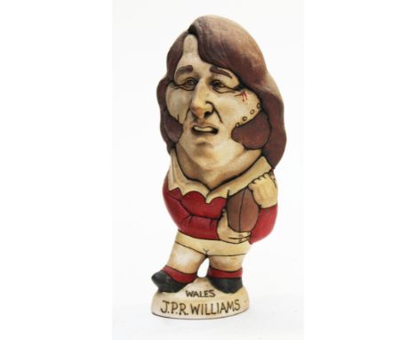 A Groggs ceramic figure of J.P.R. Williams by John Hughes, signed, height 23cm. Condition - good, general wear. 