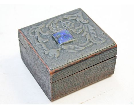 An Art Nouveau box with pewter and blue/green enamel top, length 10cm. Condition - one hinge lacking pin, loss to enamel, oth
