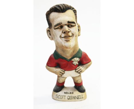 A Groggs ceramic figure of Scott Quinnell, height 25cm. Condition - good, general wear.