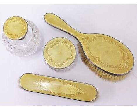 A five piece hallmarked silver and enamel dressing table set.