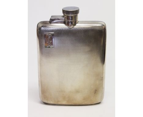 An Art Deco silver hip flask with Finnigan's Ltd retailer stamp, William Neale & Son, Birmingham, 1935, height 13.5cm, wt. 5 