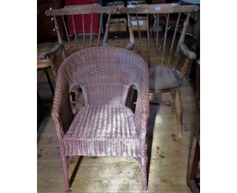 A pair of stick back carver chairs, together with a Lloyd Loom chair.
