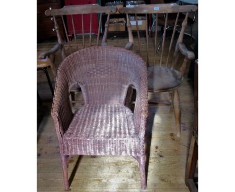 A pair of stick back carver chairs, together with a Lloyd Loom chair.