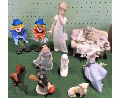 A collection of cabinet ornaments to include: a pair of Murano glass clowns, a Lladro group, Royal Doulton figure of a young 