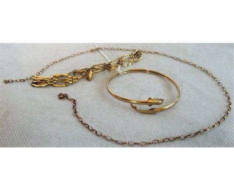 A 9 carat gold gate link bracelet, a 9ct gold chain and a bangle with dolphin head and tail terminals.  Condition Report: 15.