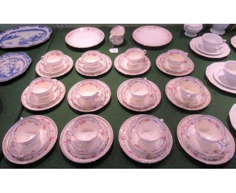 A 20th century tea service with floral decoration within a Greek Key edging, comprising: twelve trios, two cake plates and a 
