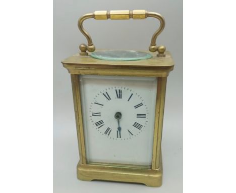 A brass four glass sided carriage clock with key, (missing hand), A/F