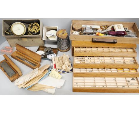 A collection of clock and watch parts, tools, etc.