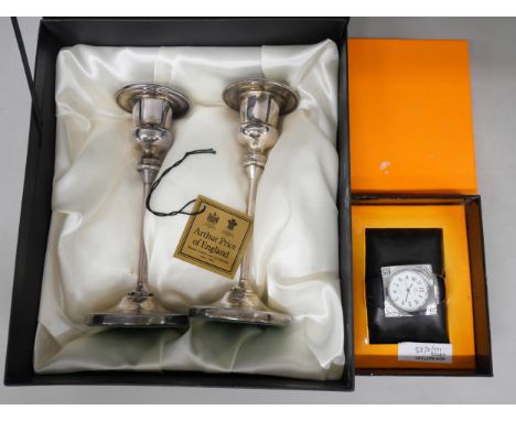 A pair of Arthur Price of England plated silver candlesticks in original box and a stainless steel Royalzz bangle watch in or