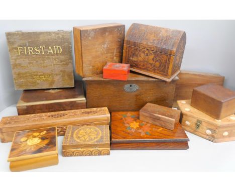 A collection of wooden boxes, to include Boots First Aid box. Other examples include carved floral designs and inlaid decorat