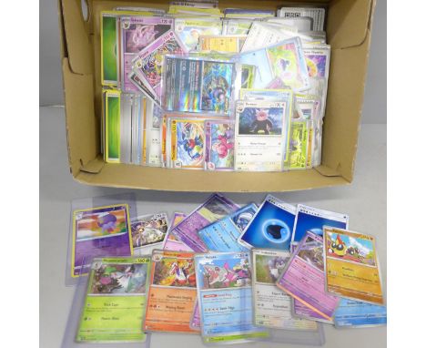 A large collection of Pokémon cards, over 1,100