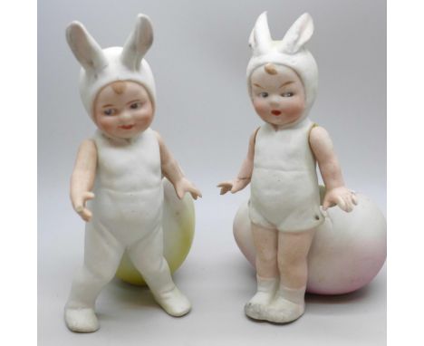 Gebruder Heubach, Germany, a of pair all bisque Easter bunny boy and girl figures with eggs and articulated arms, both a/f