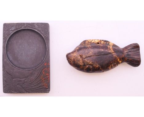 A jade fish and an inkstone. The former 8 cm long. 