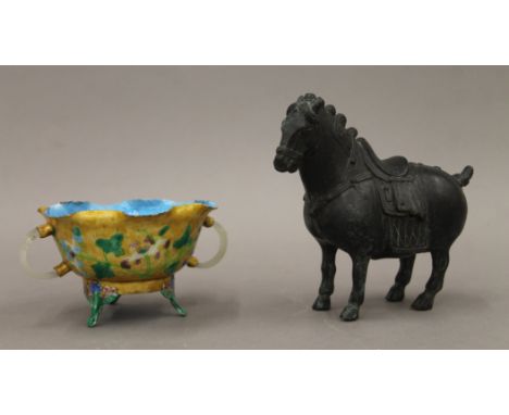 A Chinese bronze horse and an enamelled copper bowl with white jade handles. The former 13.5 cm long.