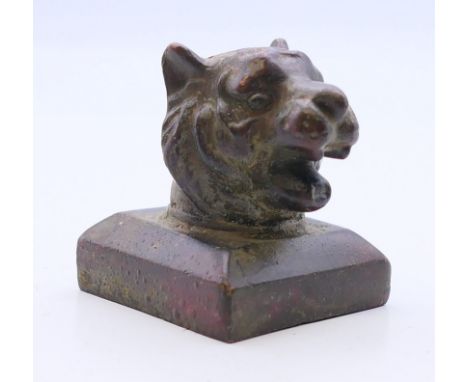 A Chinese bronze seal, the handle formed as a tiger. 3.5 cm high. 