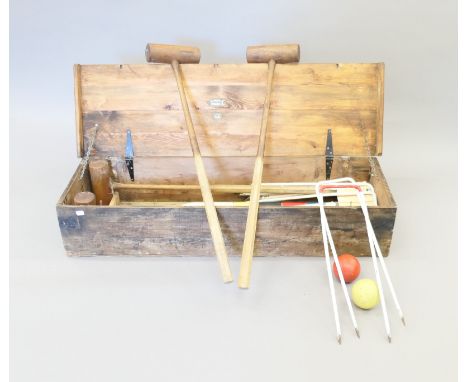 A boxed vintage croquet set. The box 114 cm long.