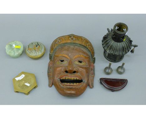 Two miniature white metal vases, a Chinese jade stand, an Eastern carved mask with wax seal, etc. The latter 27 cm high. 
