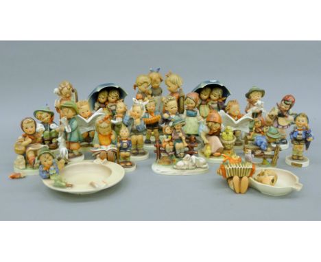 A collection of Hummel figures. The largest 18 cm high.