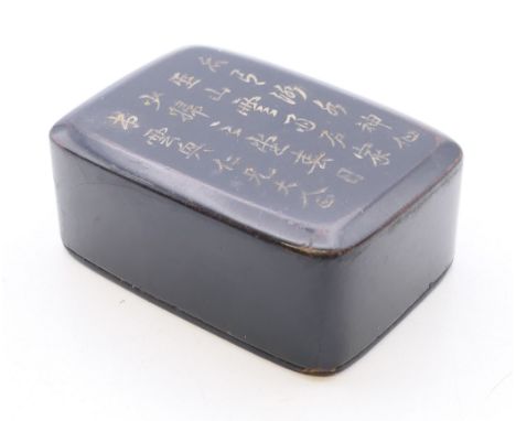 A 19th century Chinese papier mache seal box, the lid with calligraphy. 5.5 cm long. 