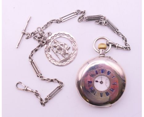 A silver half hunter pocket watch on chain with St Christopher pendant. The watch 5 cm diameter. The chain and pendant 29.2 g
