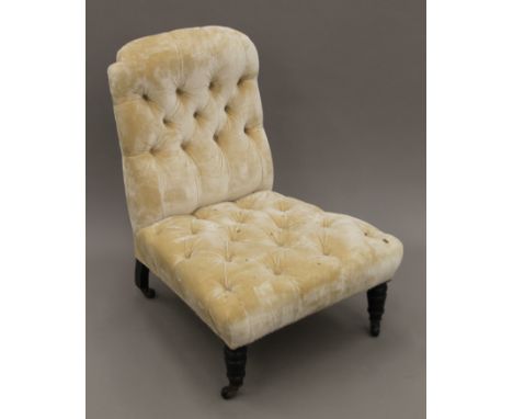 A Victorian button upholstered nursing chair. 59 cm wide.