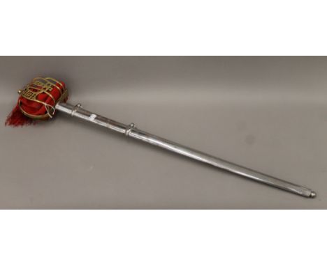 A sword with brass basket hilt and steel scabbard. 103 cm long.