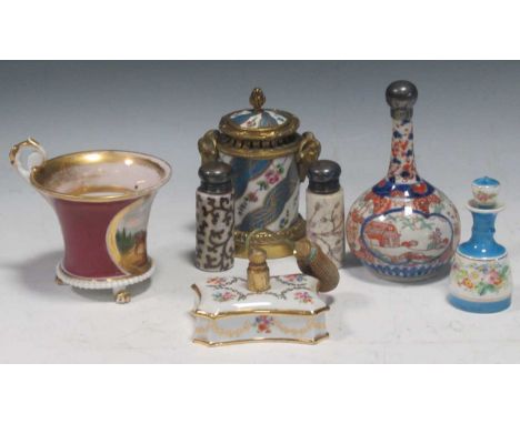 A Sevres style gilt metal mounted inkwell, a 19th century cabinet cup, a small Japanese imari vase, a porcelain perfume bottl