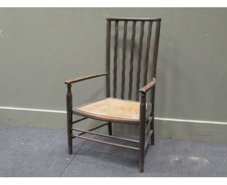 A 20th century wavy stick back elbow chair with caned seat together with a nest of three tables stamped Stag (2)