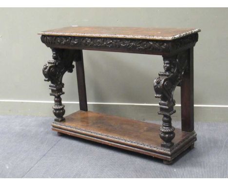 A Victorian carved oak console table with winged caryatid supports, 84 x 116 x 43cm