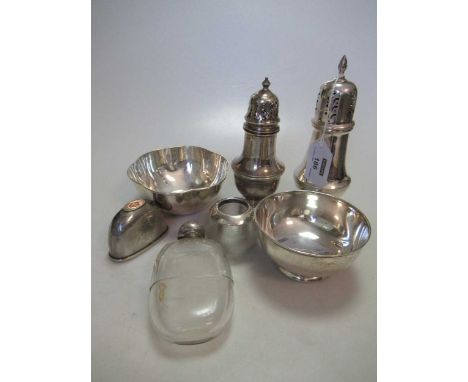 A collection of silver including a cased enamel and silver dressing table set, two silver sugar casters, a silver bowl, silve