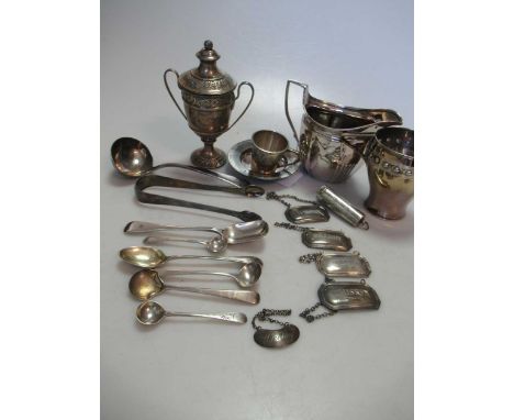 A collection of silverware including flatware, trophy, cream jug decanter labels etc, 28.6ozt gross