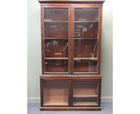 A large Edwardian mahogany glazed bookcase 261 x 151 x 36cmHeavy wear and marking to the top of the lower section. Cracking t