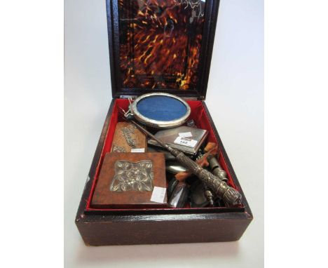 A collection of silverware and objets including a silver cigarette case, a base metal cigarette case and a third case marked 