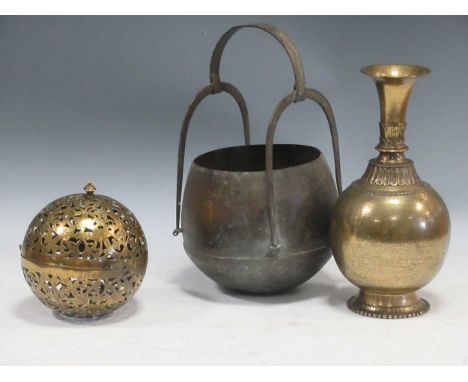 A collection of Indian metalwares to include: a brass vase, a small light shade and a hanging pot