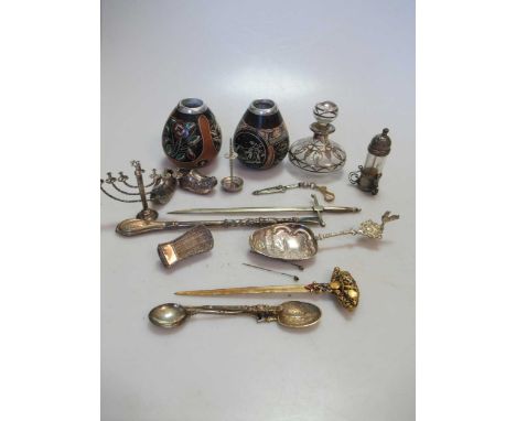 A silver mounted glass snuff bottle, a silver-gilt and enamel souvenir spoon, a Dutch silver coloured metal spoon, a group of