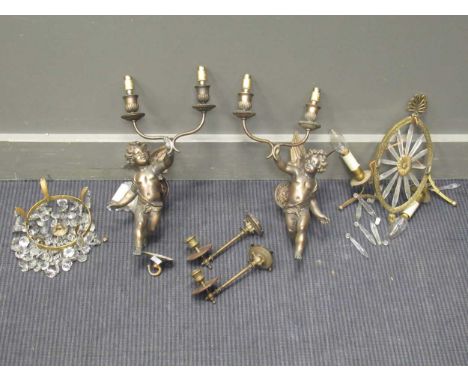 Pair of gilt wall lights modelled as cherubs, two hinged candle holders and a glass and brass bag lightthey are made of metal