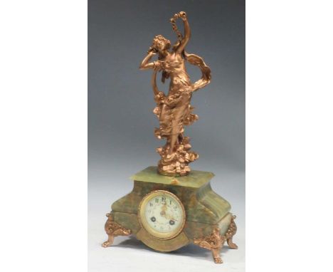 An Art Nouveau onyx based figural gilt metal mantle clock