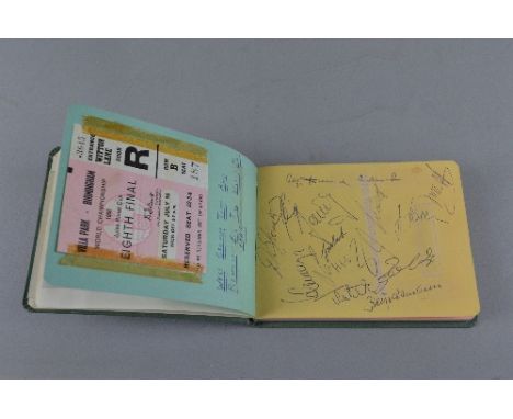 AN AUTOGRAPH BOOK, signatures include Jackie Stewart, Stirling Moss, Jack Brabham and members of the Spanish and West German 