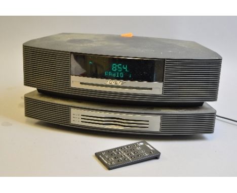 A BOSE WAVE MUSIC SYSTEM, with multi CD changer in slate grey, model No.WWRCC5, Serial No.033983351510304AC with remote contr