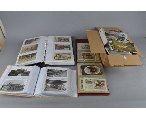 THREE ALBUMS AND ONE BOX OF VINTAGE AND MODERN POSTCARDS AND PHOTOGRAPHS, many from the Victorian/Edwardian era, mostly greet