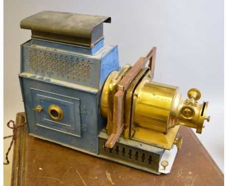 A TINPLATE AND BRASS MAGIC LANTERN, with two boxes of slides, one box of Norfolk landmarks and the other of England and Europ