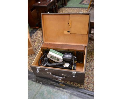 A vintage Singer electric sewing machine; a Singer button hole attachment etc.(3)