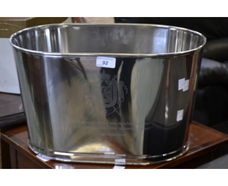 A modern chrome reproduction champagne trough, inscribed with Lily Bollinger quote 'I drink it when I'm happy and when I'm sa