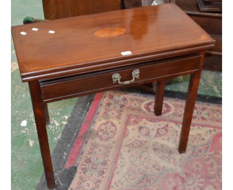 An early 19th century mahogany card table inlaid with satinwood fan shaped patera, baize playing surface, single drawer to fr