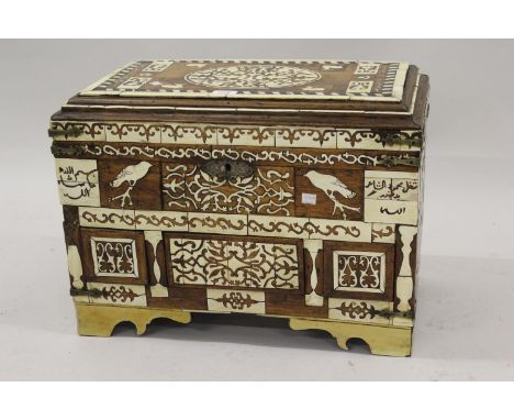 North African hardwood bone and ivory inlaid trunk, circa 1920 / 30, the hinged moulded cover above a lined interior and thre