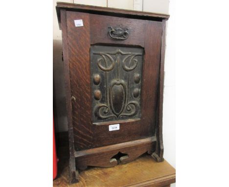 Art Nouveau oak coal purdonium with embossed copper panel inset fall front (at fault), together with a light oak bedside cabi