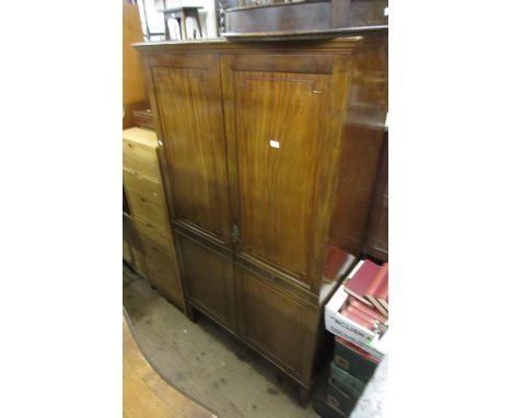 Edwardian mahogany wardrobe, the moulded cornice above a pair of panelled and moulded doors enclosing a shelf and hanging spa