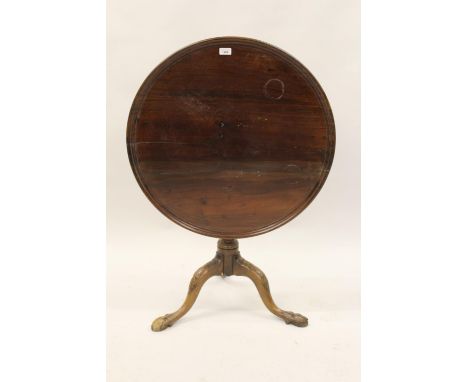 George III mahogany circular pedestal table, the dish top above a wrythen baluster column support and carved tripod base with